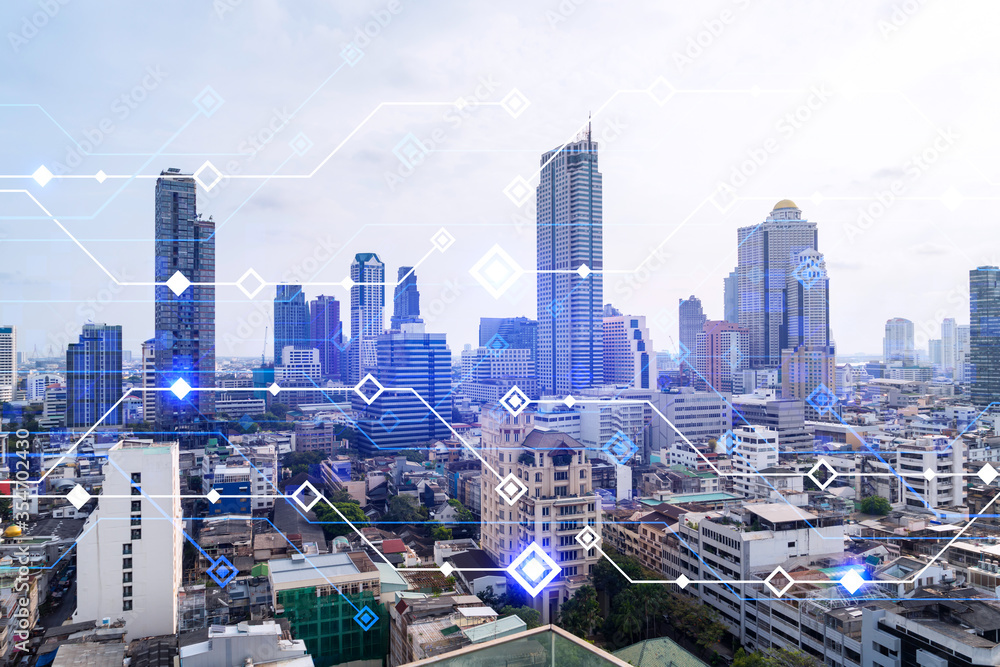 Obraz premium Technology hologram over panorama city view of Bangkok. The largest tech hub in Asia. The concept of developing coding and high-tech science. Double exposure.