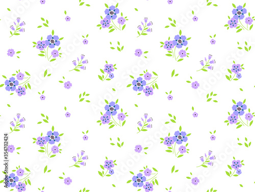 Vintage floral background. Seamless vector pattern for design and fashion prints. Flowers pattern with small lilac flowers on a white background. Ditsy style.