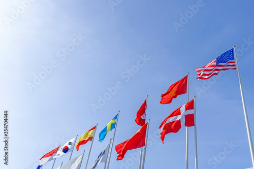 Flagpole international global with blue sky background