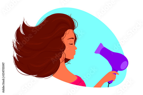 Girl dries long curly hair with a hairdryer.