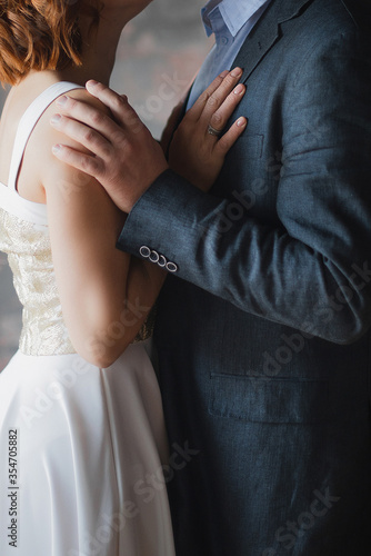 Newlyweds love story in studio close-up. European wedding