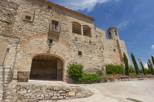 Montfalc   Murallat entrance. Montfalc   Murallat is located in the Segarra region  perched on top of a hill. It is an example of a medieval enclosed village in Catalonia  Spain .
