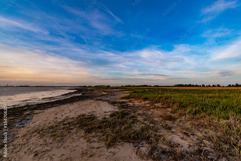 Sunset on the North Sea beach in East Frisia in early summer Sunset on the North Sea beach in East Frisia in early summer
