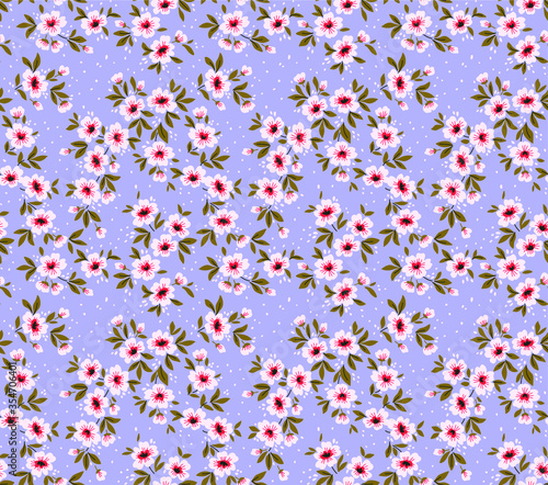 Vintage floral background. Seamless vector pattern for design and fashion prints. Flowers pattern with small white flowers on a light blue background. Ditsy style.