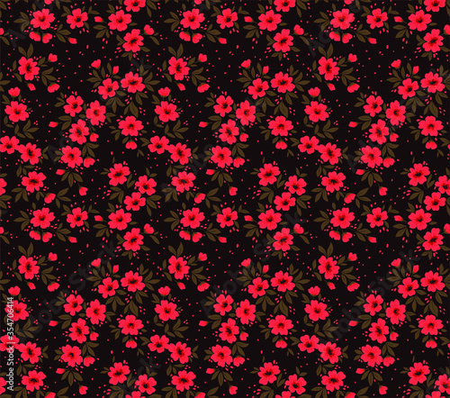 Vector seamless pattern. Pretty pattern in small flower. Small red flowers. Dark brown background. Ditsy floral background. The elegant the template for fashion prints.