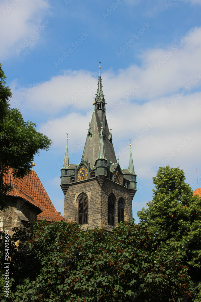 Clock at the tower of the church. Religious gothic building.