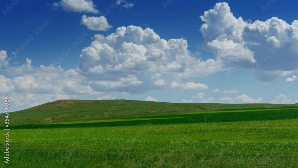 Green hill with grass under cloudy sky, panorama timelapse 4k Green hill with grass under cloudy sky, panorama timelapse 4k