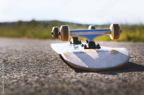 Skateboard is on the street in good weather - 6 photo