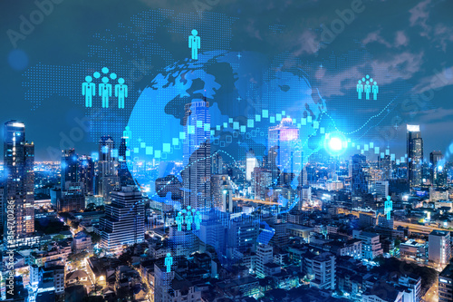 Glowing Social media icons on night panoramic city view of Bangkok  Asia. The concept of networking and establishing new connections between people and businesses. Double exposure.
