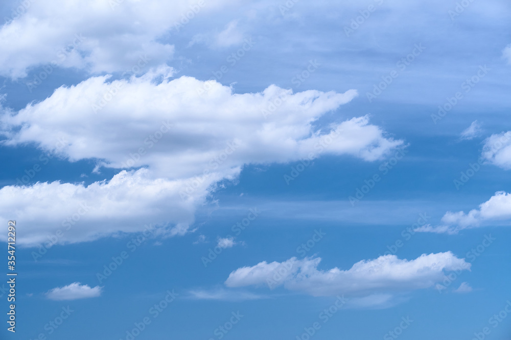 Bright beautiful blue sky with soft clouds, bright sunny day Bright beautiful blue sky with soft clouds, bright sunny day