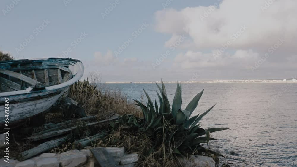 Dramatic beachfront view with scenic boat at Quebrado facing Baleal's horizon. Dramatic beachfront view with scenic boat at Quebrado facing Baleal's horizon.