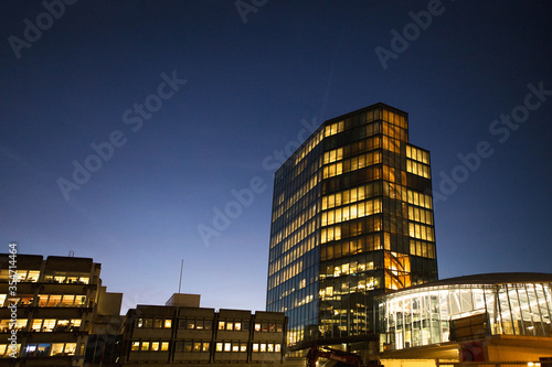 Photography Cityscape skyline with office buildings on the bank of the river during twilight blue hour, Utrecht, Netherlands, north Holland, Europe