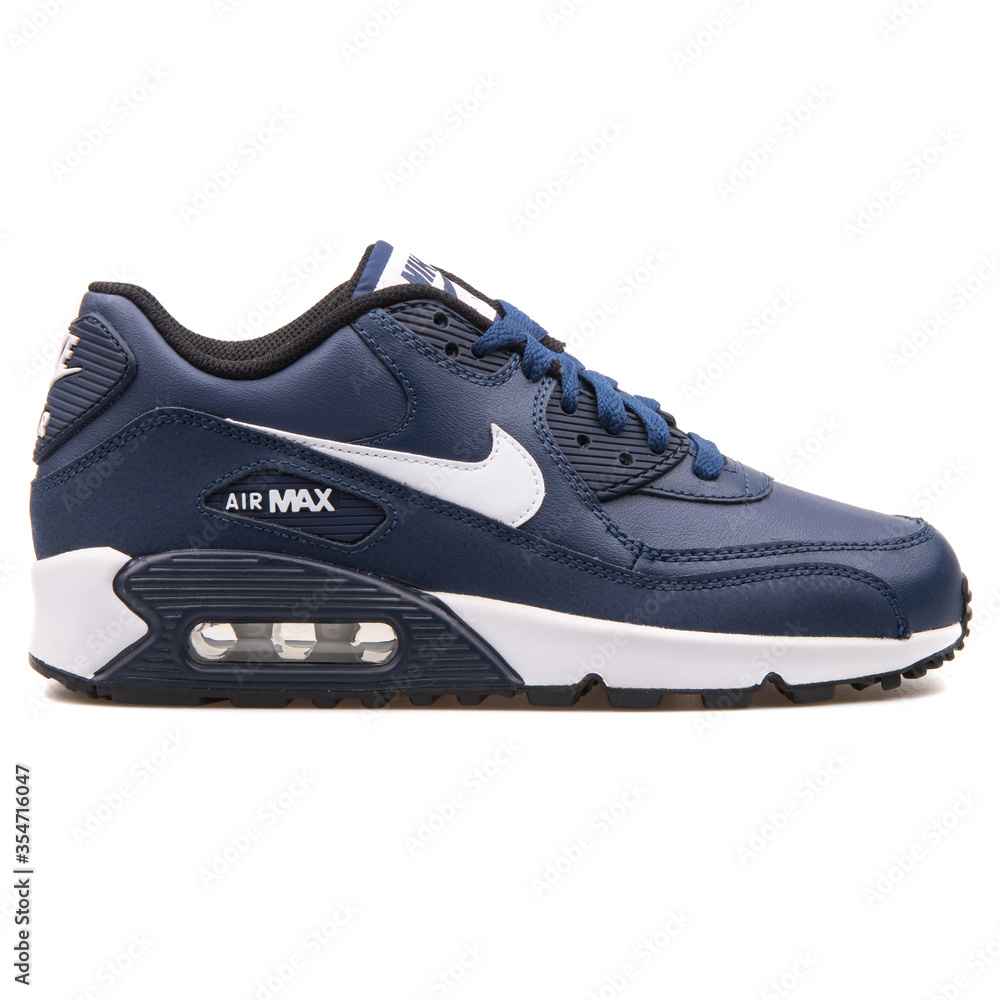 VIENNA, - AUGUST 25, 2017: Air Max 90 Leather navy blue and white sneaker on background. Stock Photo Adobe Stock