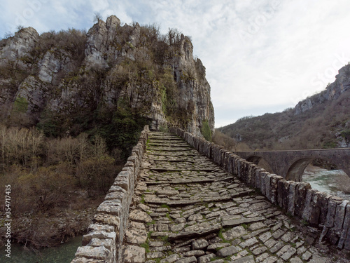 Arch stone bridge on Vikos gorge photo