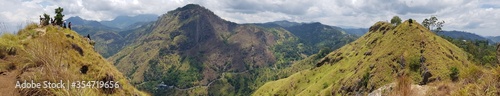 Many Hills Under Cloudy Sky in one Capture