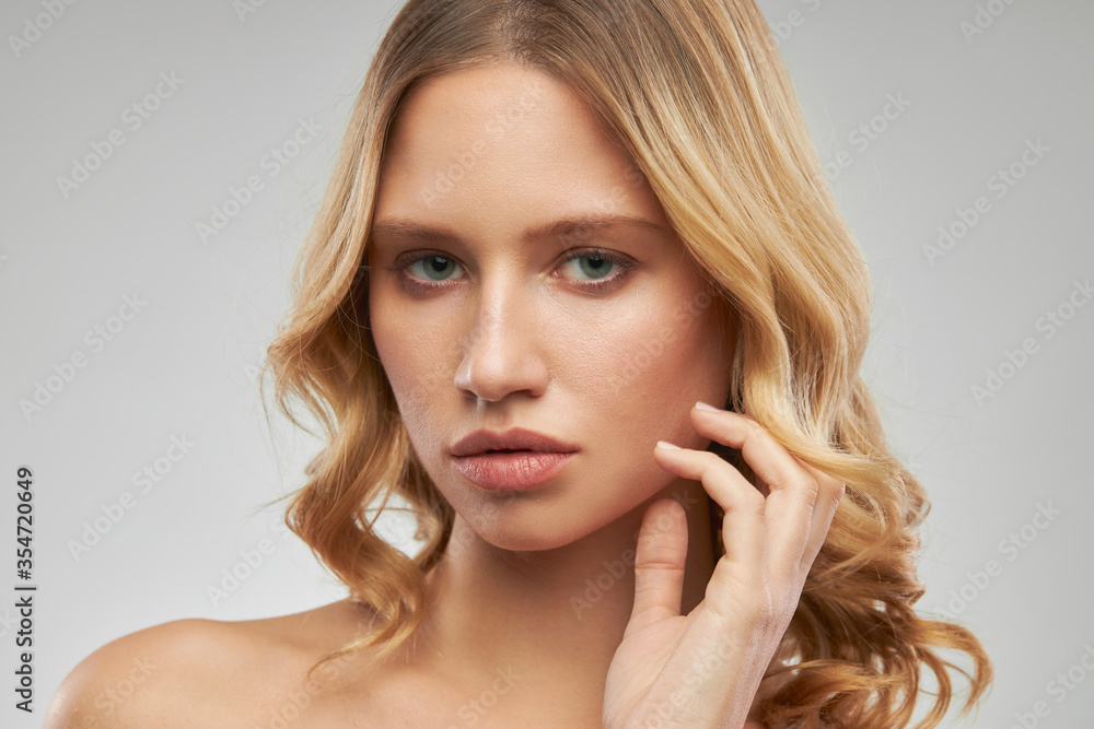 Portrait of beautiful blonde looking at camera and posing. Portrait of beautiful blonde looking at camera and posing.
