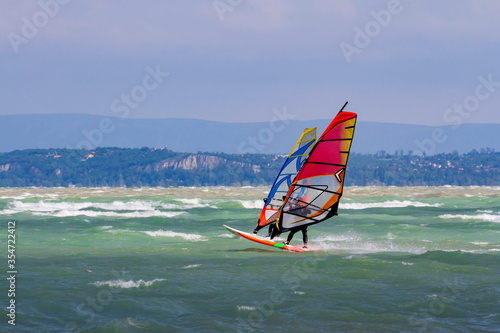 Windsurfers on Lake Balaton, Hungary. Partially sunny with wind and waves