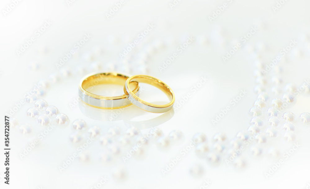 Wedding Rings on white heart background Wedding Rings on white heart background