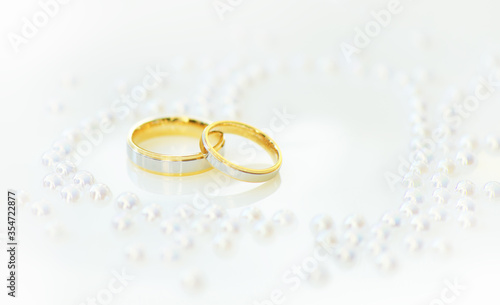 Wedding Rings on white heart background