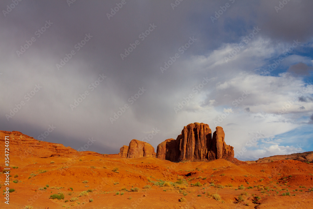 Storm arriving at Monument Valley Tribal Park. Landscape with red rocks