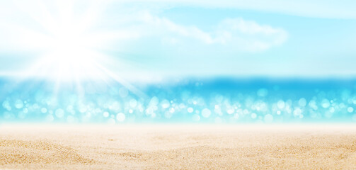 Summer tropical sea with sparkling waves, sand and blue sunny sky