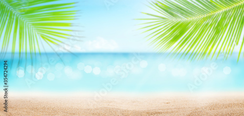 Summer tropical sea with sparkling waves  sand and blue sunny sky