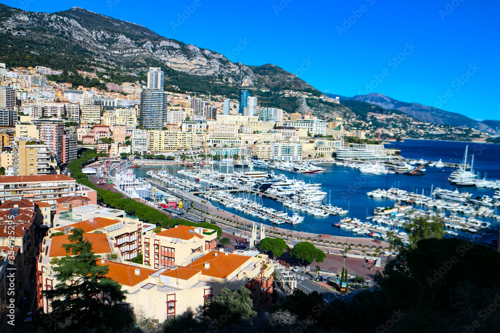 View of Monte Carlo harbor and the Mediterranean coast of the French Riviera in Monaco-Ville, Monaco. 