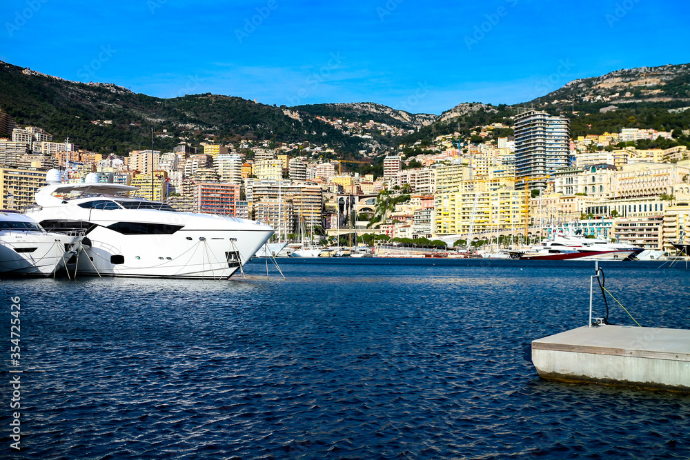 Φωτογραφία Skyline of Monte Carlo with luxury yachts anchored in the harbor on a sunny day