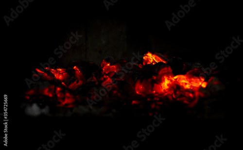 Smoldering embers in the fireplace