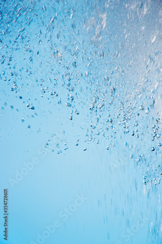 bright splash of water against the blue sky © nata777_7