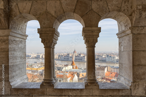 Hungary Parliament dome view through corridor column on fisherman's bastion on Budapest ountain