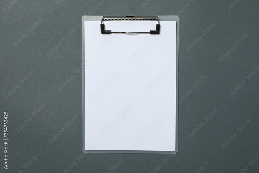 Empty clipboard on light black background, space for text Empty clipboard on light black background, space for text