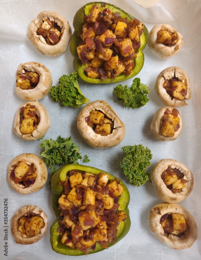 Baked mushroom and bell peppers stuffed with cottage cheese and kale 