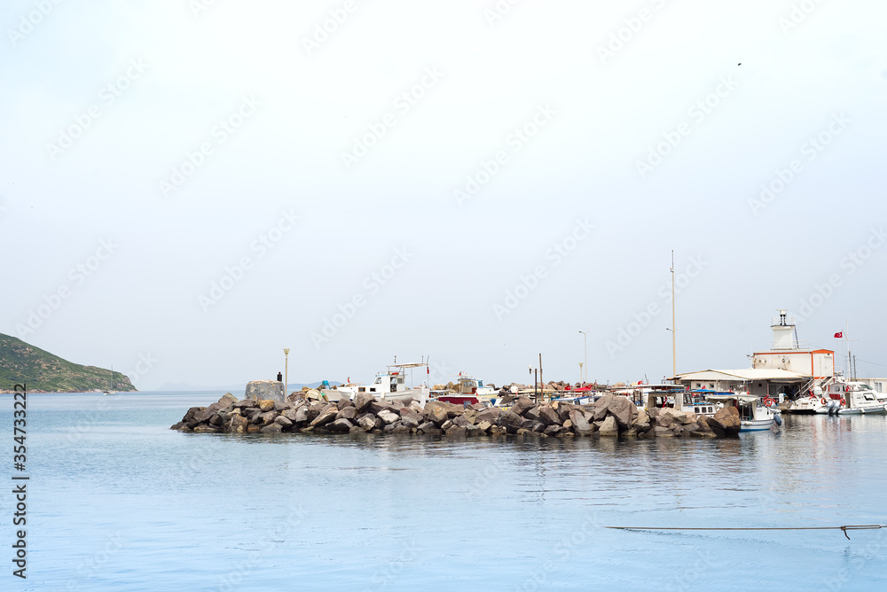 Beautiful sea, sky and a boat at Turgutreis harbor in Bodrum,