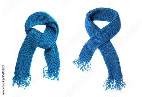 Blue knitted scarf on a white background. photo