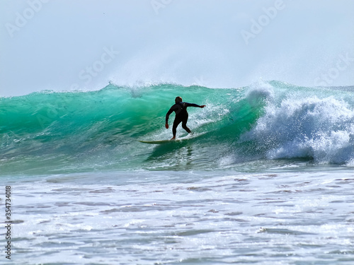Surfer on his board sporting in the ocean © Stimmungsbilder1