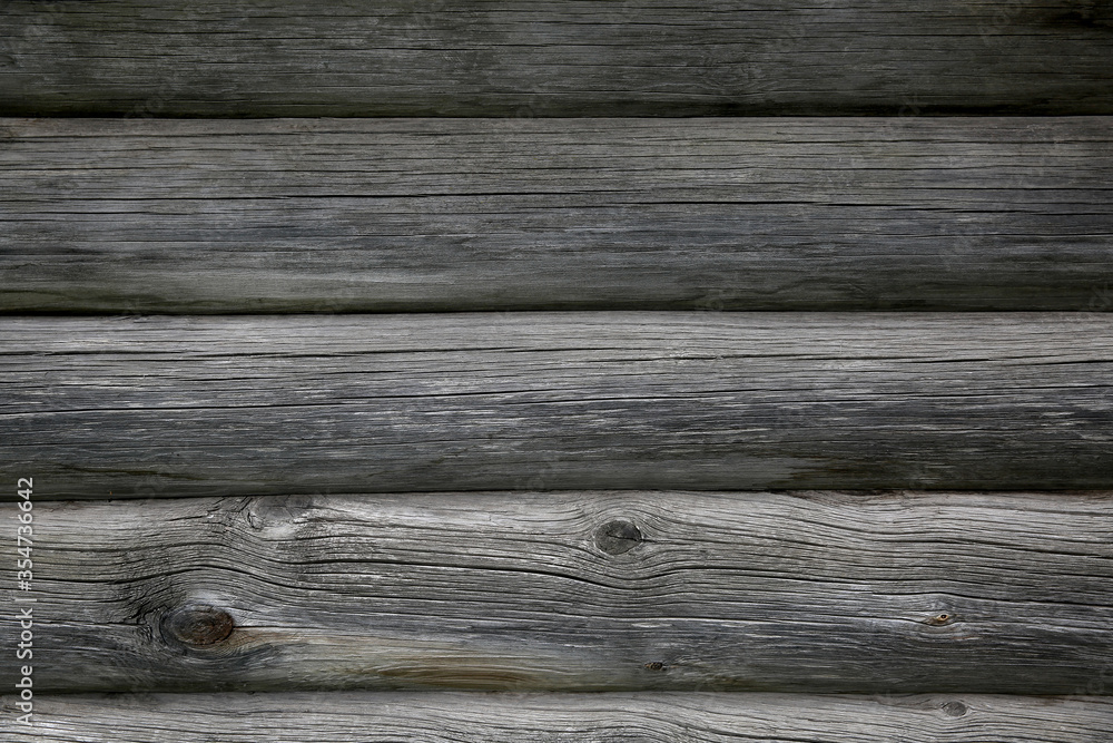 Background from the texture of the old gray wood logs Background from the texture of the old gray wood logs