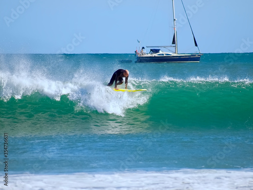 Surfer on his board sporting in the ocean © Stimmungsbilder1