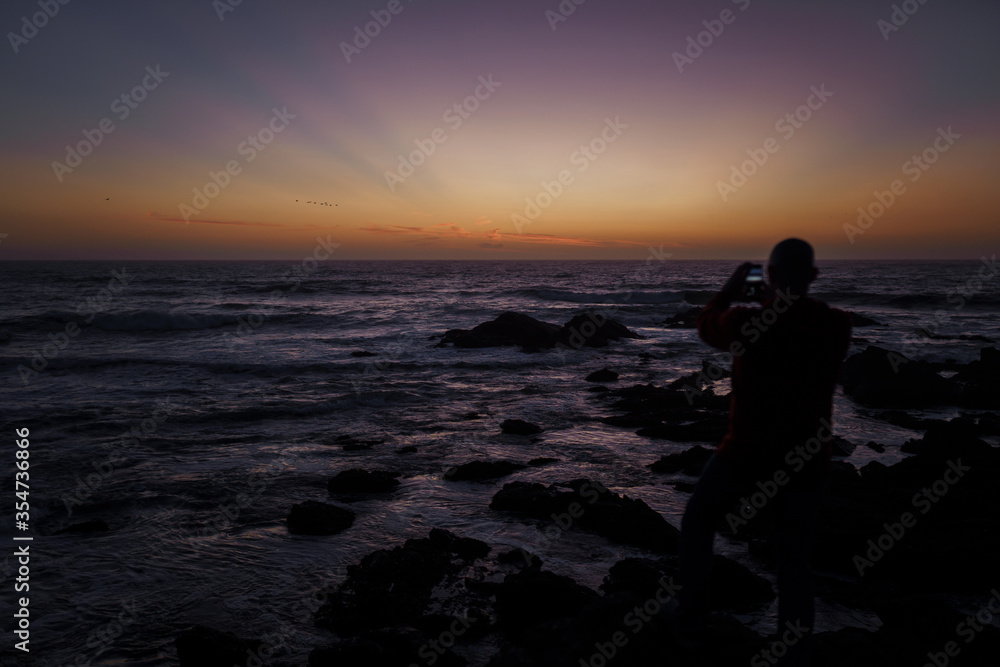 Photographer on the  Pacific coast