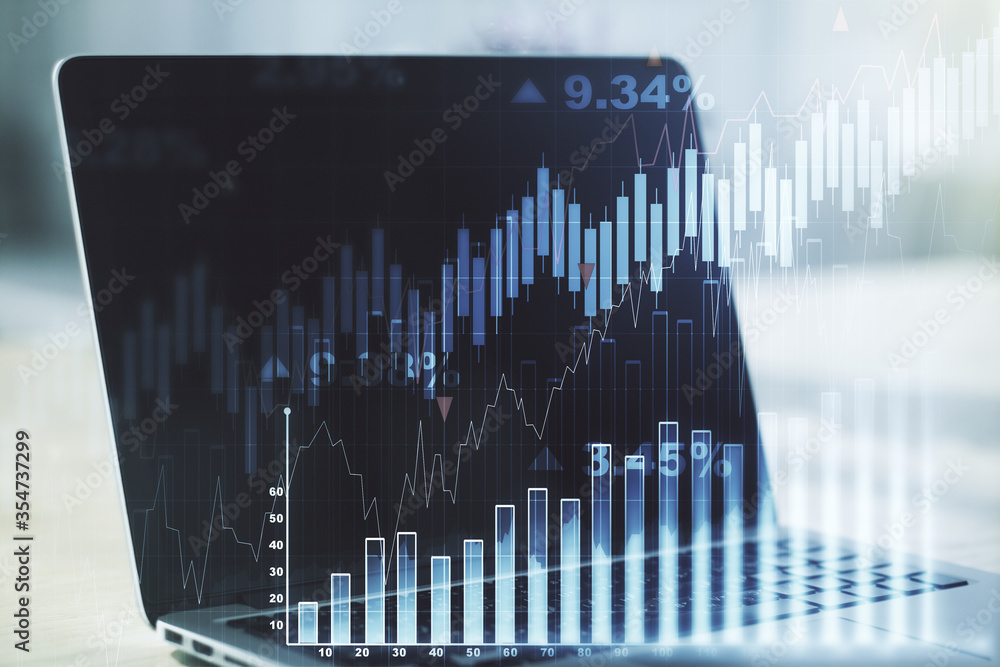 Abstract creative financial graph on modern laptop background, financial and trading concept. Multiexposure Abstract creative financial graph on modern laptop background, financial and trading concept. Multiexposure
