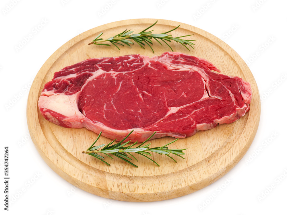 Raw steak on wooden plate isolated on white background Raw steak on wooden plate isolated on white background