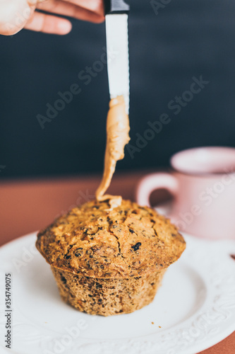 cup of black coffee and cake muffin cinnamon walnuts on a plate glutenfree vegan sugarfree peanut butter