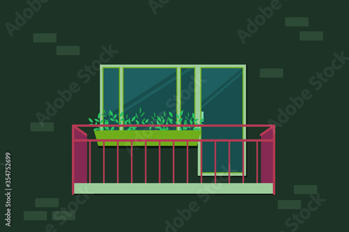 Open balcony with red bars. Plastic window and door. Outdoor flower bed. Brick wall.