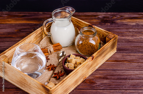 Ingredients for Dalgon coffee in a box on a wooden background. photo