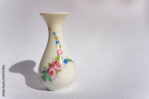 little porcelain vase with flowers, antique collection, porcelain figures