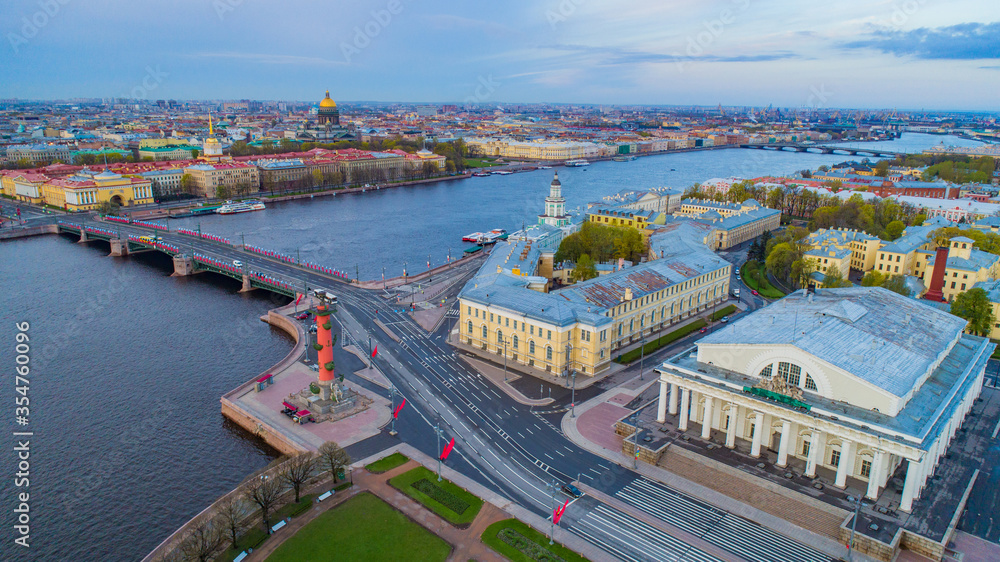 Saint Petersburg. Russia. View of St. Petersburg from a height. Panorama of St. Petersburg from Vasilievsky island. Palace bridge over the Neva river. Rostral column. Early morning in the city.