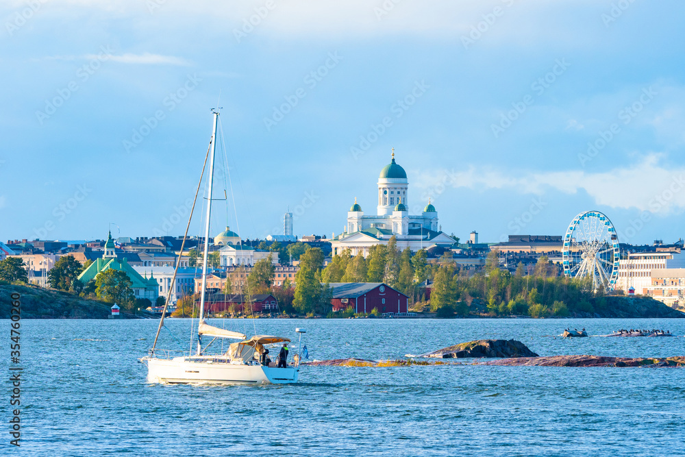 Panorama of Helsinki from the Gulf of Finland. The yacht sails in the port of Helsinki. Sights of the Finnish capital. St. Nicholas Cathedral in Helsinki. Holidays in Scandinavia.