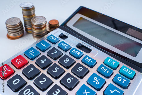Coins and a calculator on a...