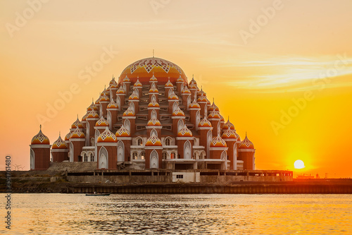 Masjid 99 Kubah (99 Domes Mosque), a beautiful Mosque with unique architecture, located in famous destination, Losari Beach, Makassar, South Sulawesi, Indonesia. A new Landmark of Makassar City. photo