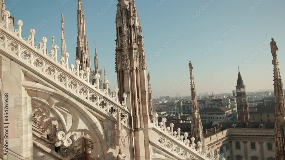 Sculptures saints and martyrs decorating the Cathedral Milan Duomo di Milano are shot close-up. Detail of luxury facade with many marble statues, reliefs. Sculptures saints and martyrs decorating the Cathedral Milan Duomo di Milano are shot close-up. Detail of luxury facade with many marble statues, reliefs.